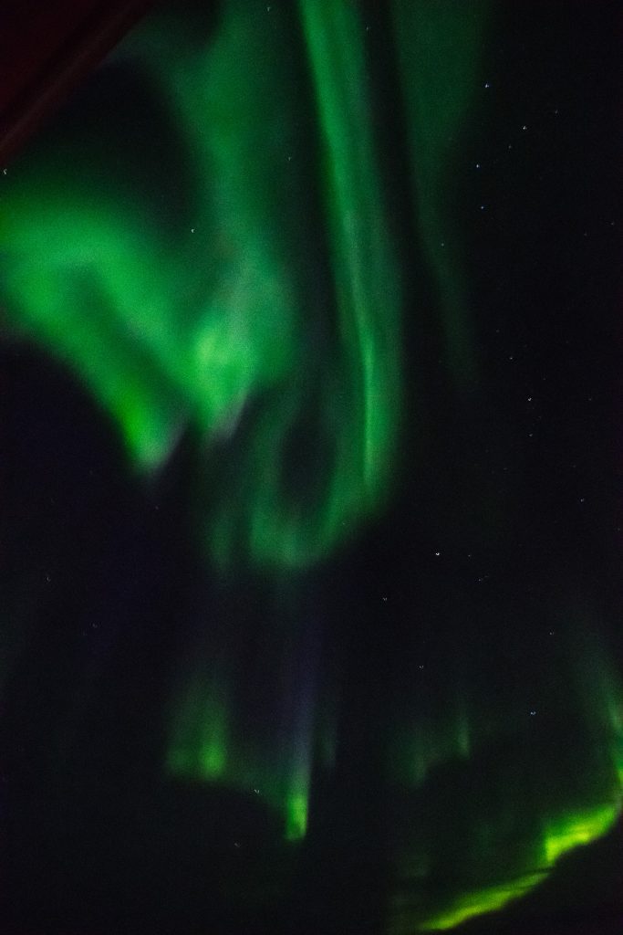 A curved band of northern lights in the Canadian Arctic. 