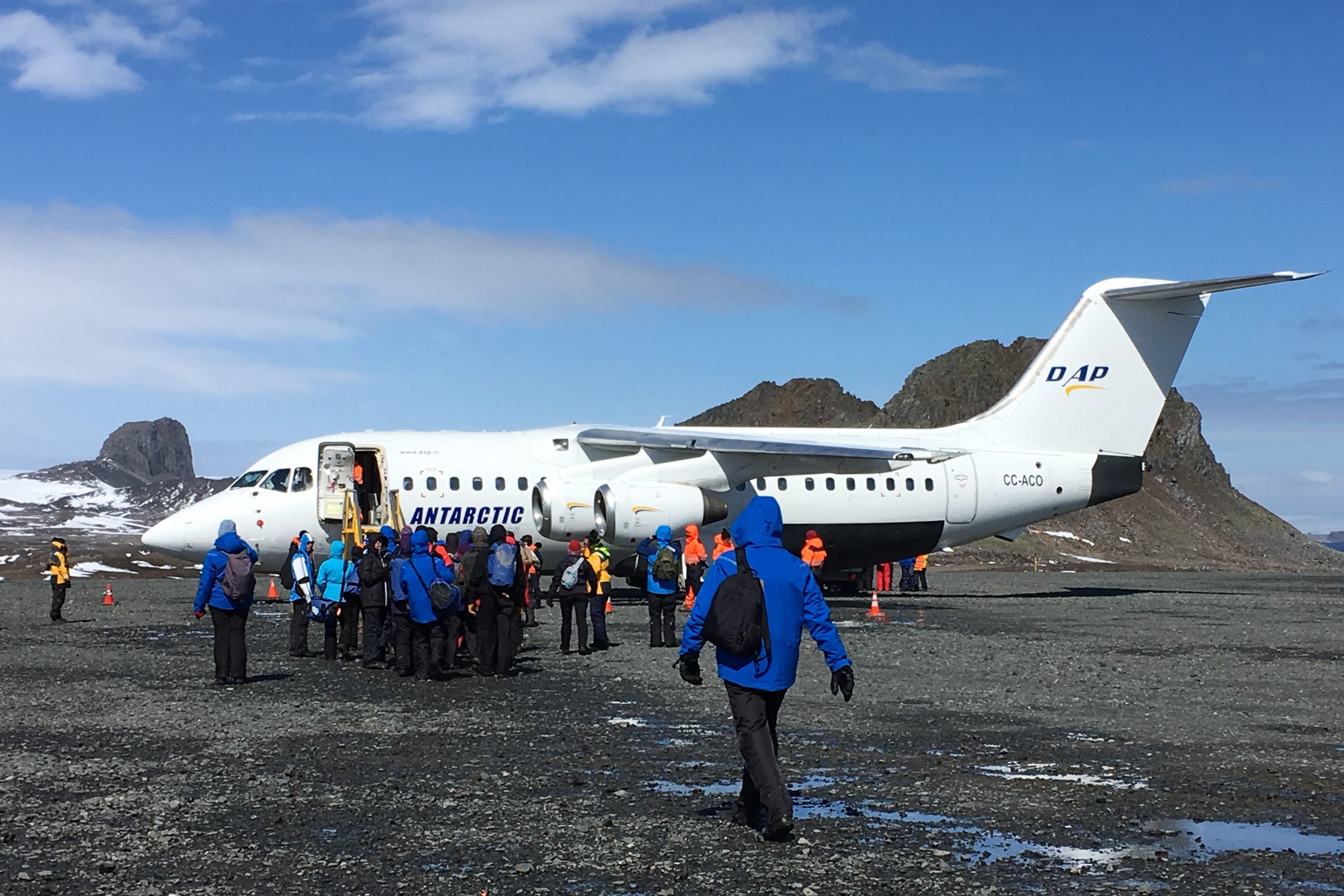 Passengers embarking airplane in Antarctica. 
