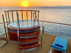 Outside Jacuzzi with ocean view and sunset on Ocean Explorer