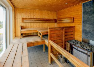 Sauna with wooden bench and walls on Ocean Explorer. 