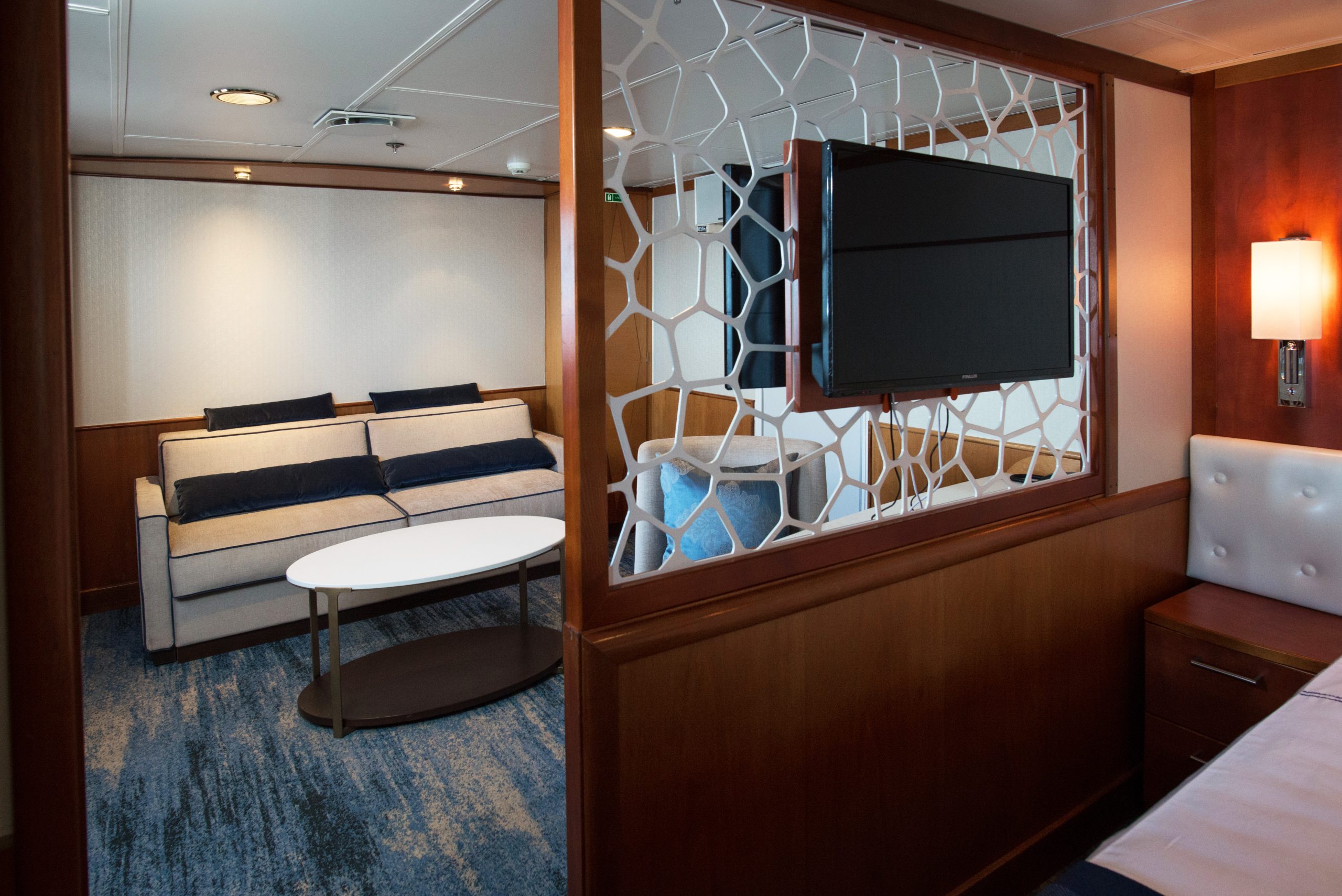 Interior of a Suite cabin on the ship Expedition showing sitting area with couch.