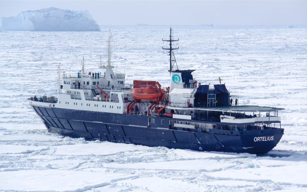 Ship sailing in the pack ice in Antarctica