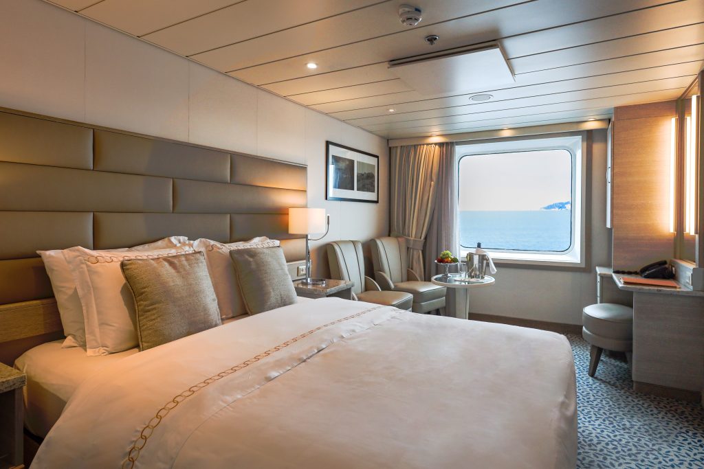 Queen bed and large window. 