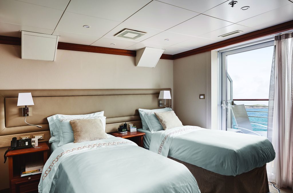 Two twin beds and sliding glass door. 