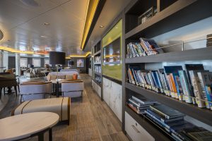 Library on Sylvia Earle showing bookcases full of books and couch