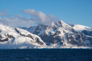A rugged mountain landscape at the coastline. 
