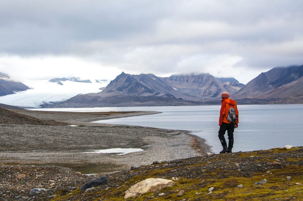 A guest hiking along shoreline.