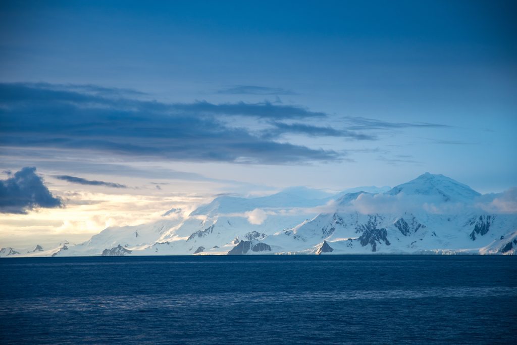 Snow covered mountains at sunset.