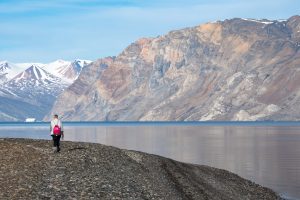 Guest hiking in fjord in East Greenland.
