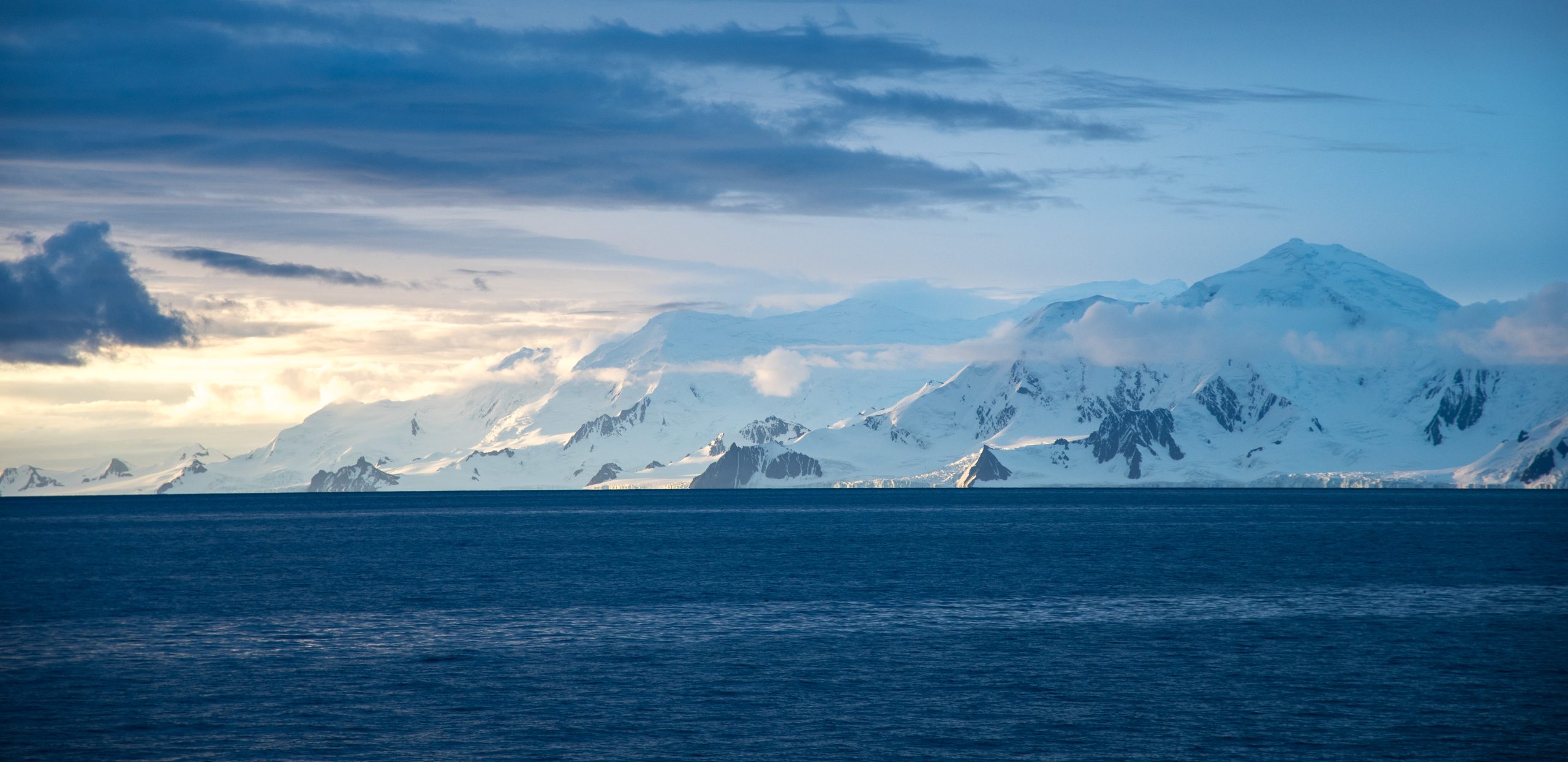 Snow covered mountains at sunset.