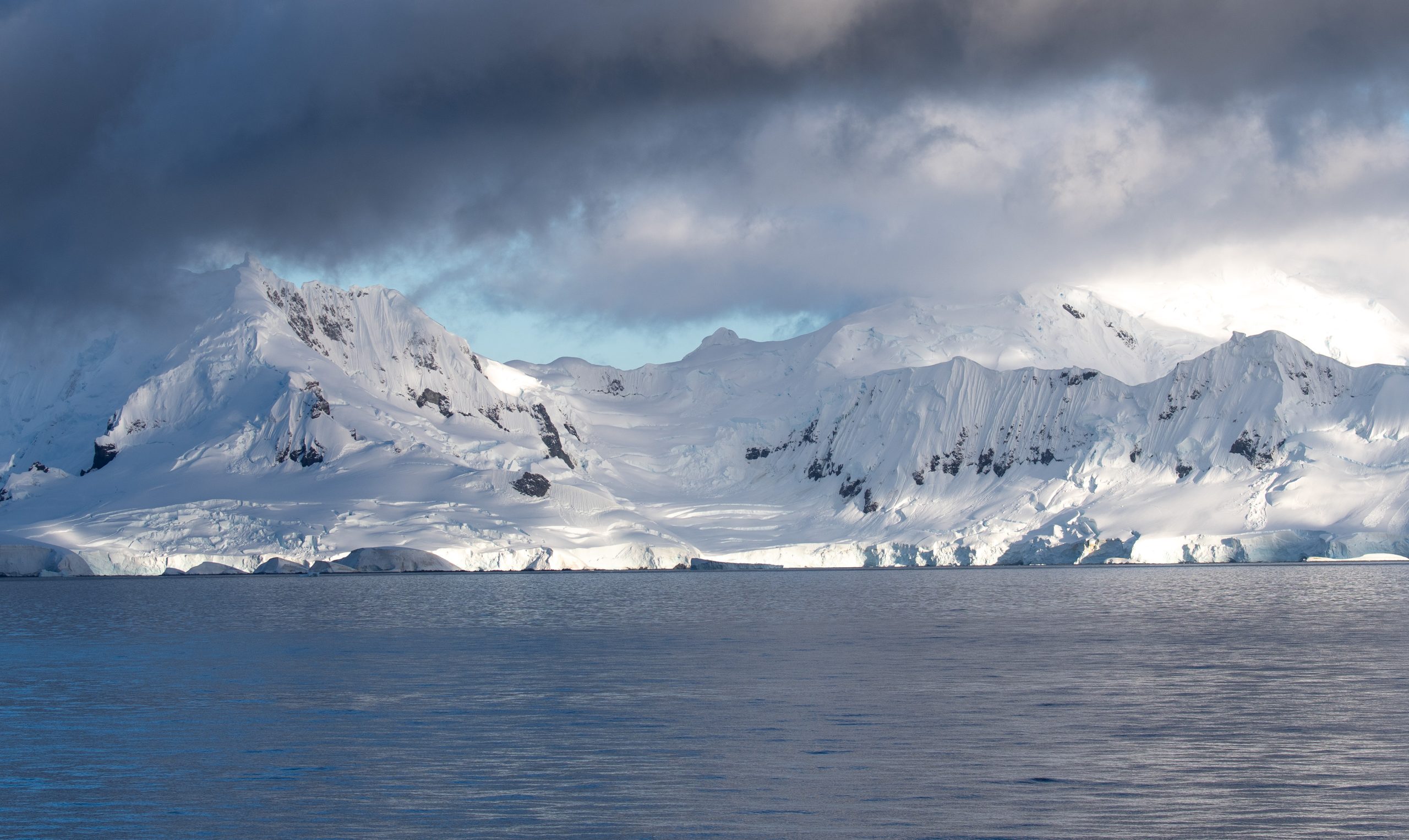 Snow covered mountains in the clouds.