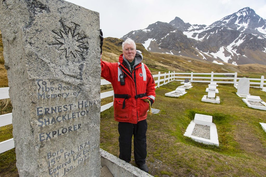 Guest standing next to Shackleton's grave in South Georgia.