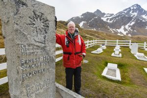 Guest standing next to Shackleton's grave in South Georgia.