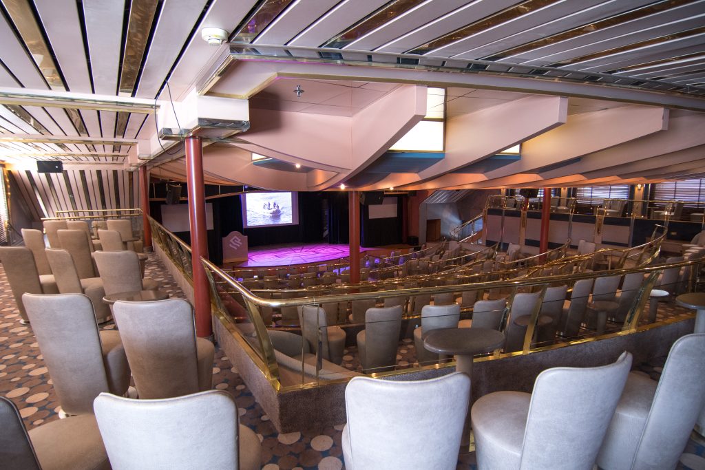 Explorer Lounge on Silver cloud with stage and tiered seating. 