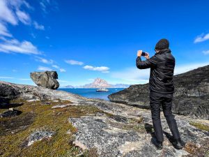 Guest from the National Geographic Resolution just off the town of Uummannaq, Greenland..