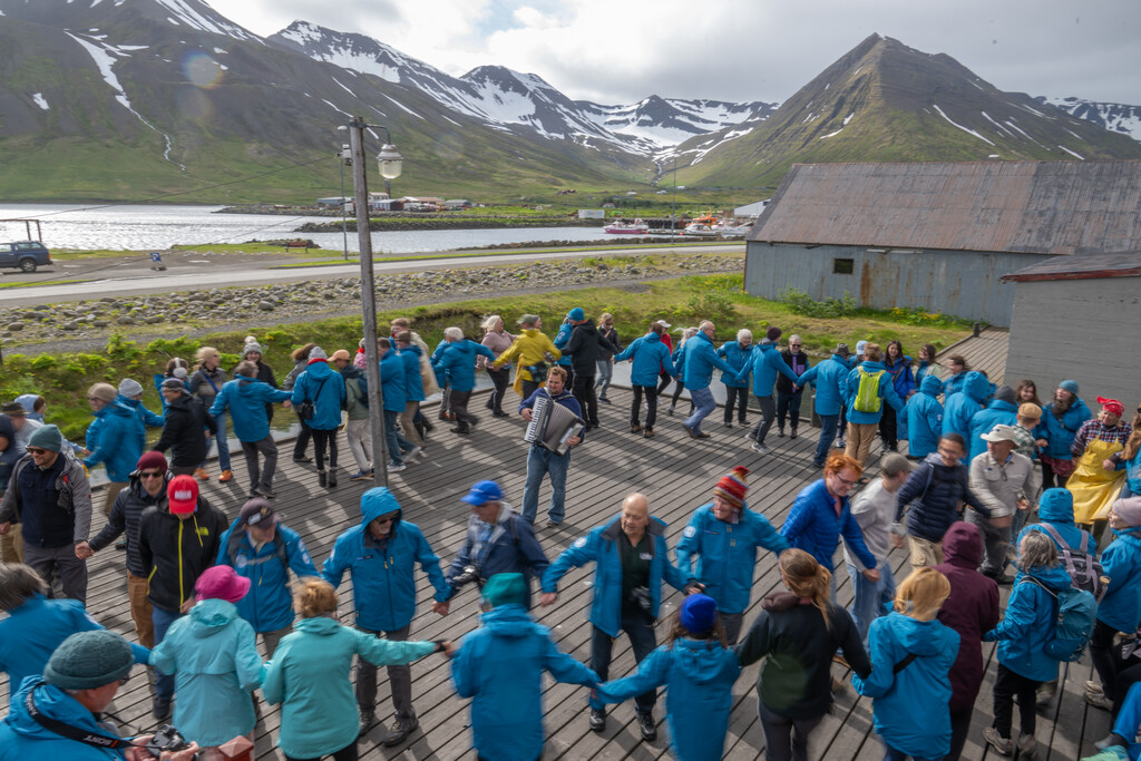 Guests dancing in a circle in Iceland.