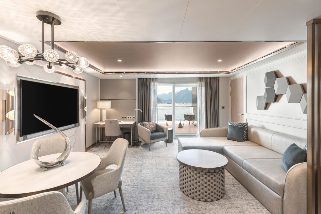 Signature Suite on Silver Endeavour with couch and table. 