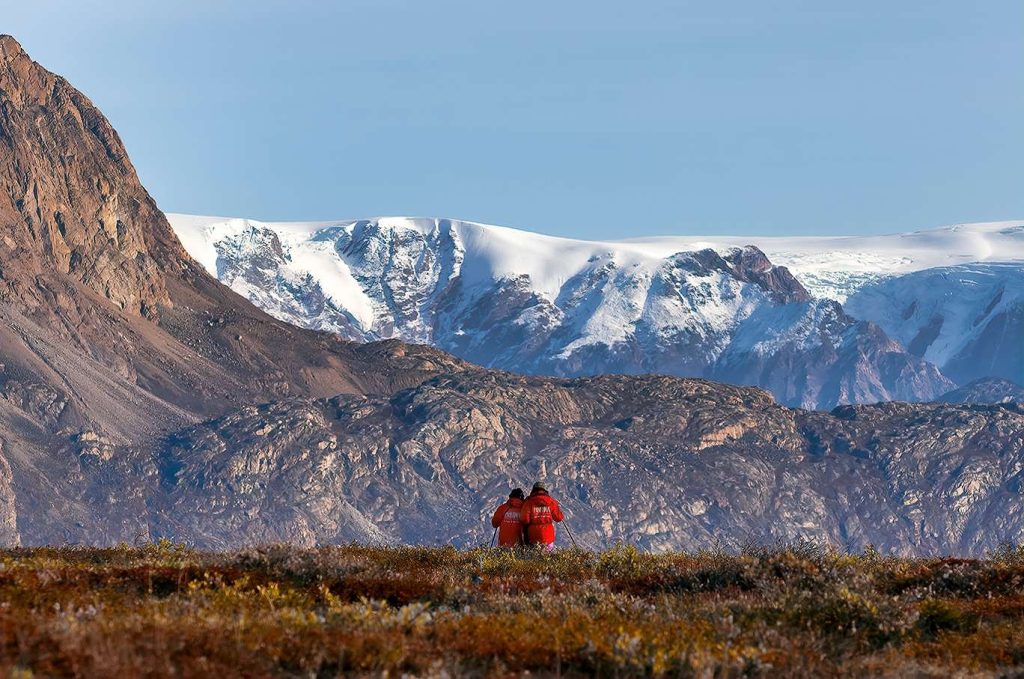 Guests hiking with beautiful mountain scenery.