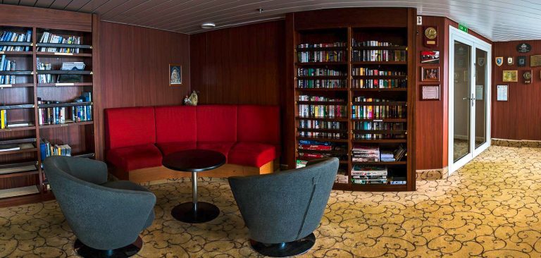 Library on the Expedition with book shelfs, sofa and chairs