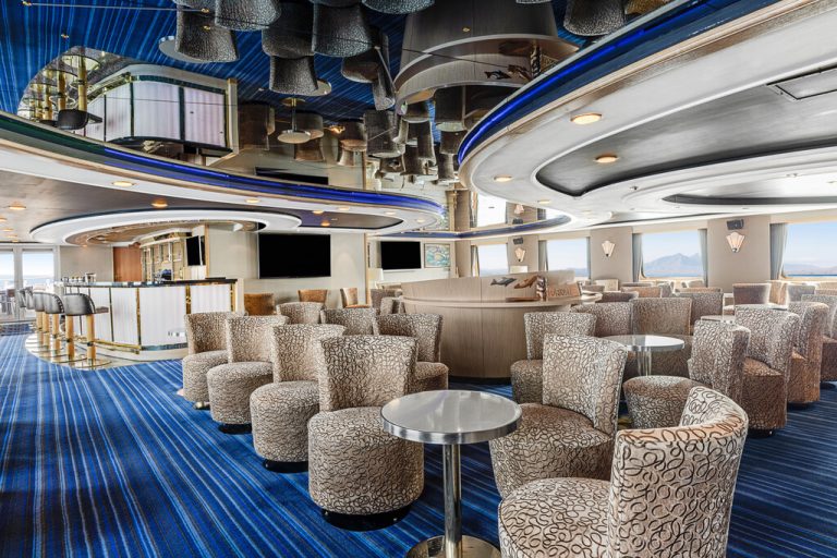 National Geographic Orion lounge with multiple tables and chairs