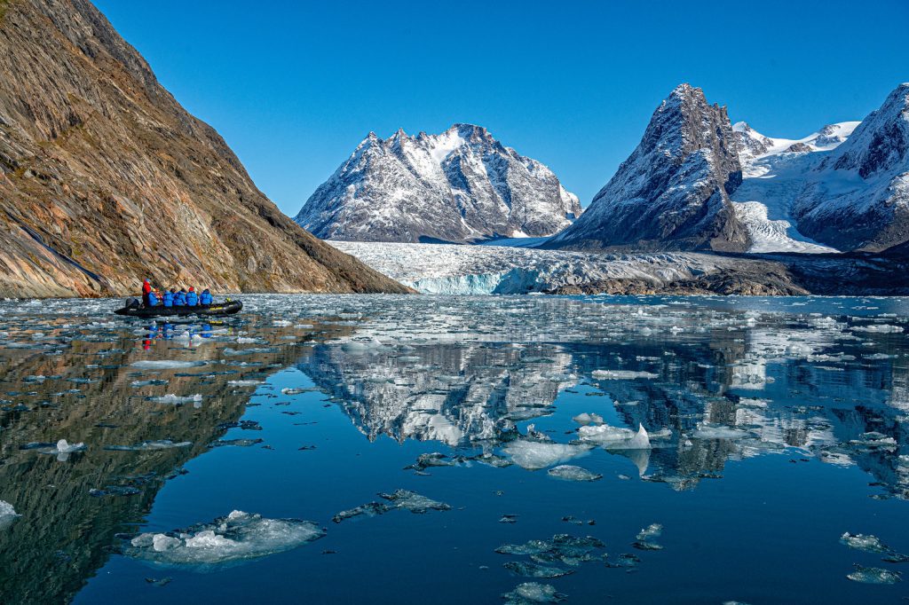 Zodiac cruising in incredibly scenic fjord. 