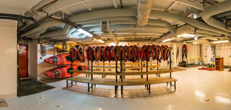 Mudroom on G Expedition with lifejackets and stored kayaks