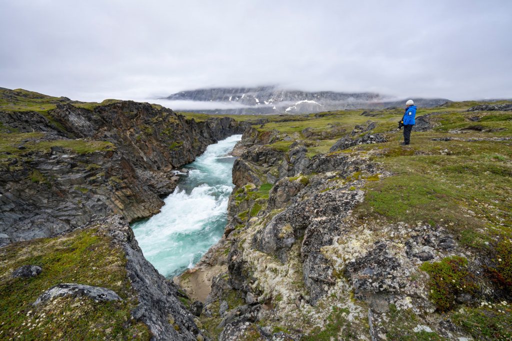 Guest looking at waterfall.