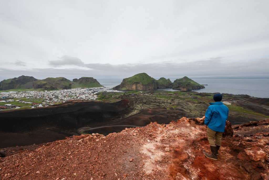 Guest taking in view at Heimaey Island, Iceland.