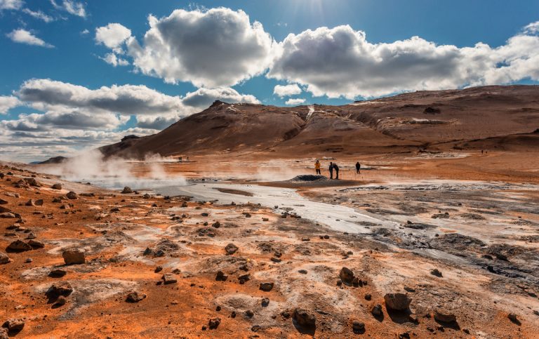 Tipical Icelandic nature landscape. Hverarondor Hverir geothermal area in Iceland near Lake Myvatn. The area with multicolored mud, cracked and steam. popular travel and hiking destination