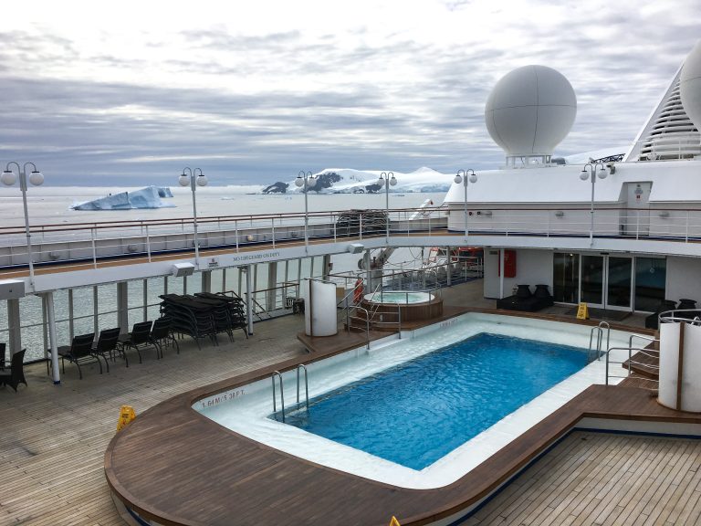 Pool deck with small pool, hot tubs and jogging track onboard Silver Cloud.