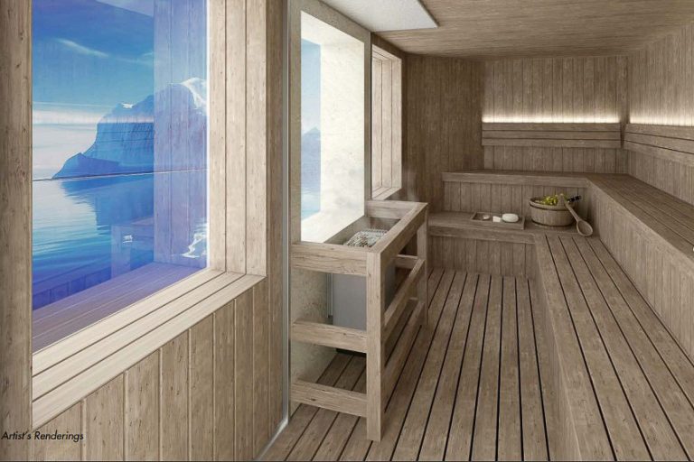 Sauna with wooden bench seating and large picture windows.