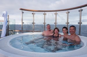Guests enjoying the outdoor Jacuzzi on Ocean Victory.