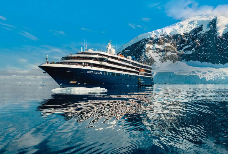 World Voyager expedition ship with glacier in background