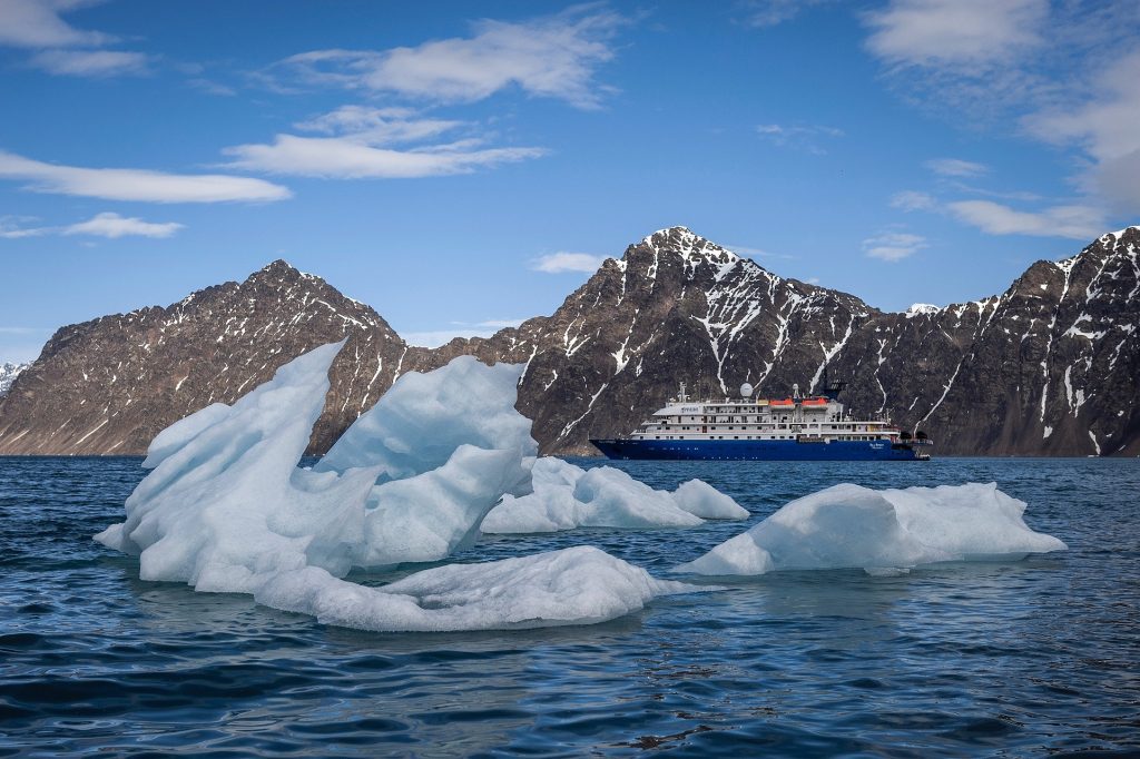 Iceberg with the ship Sea Spirit in background.