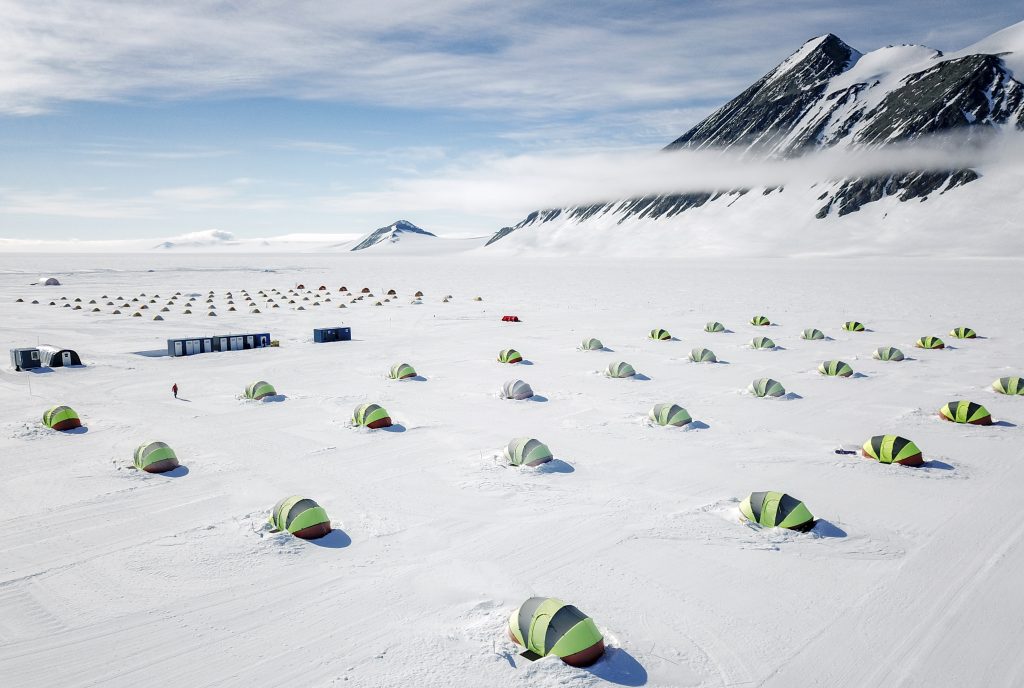 Overhead view of Union Glacier camp with rows of tents.