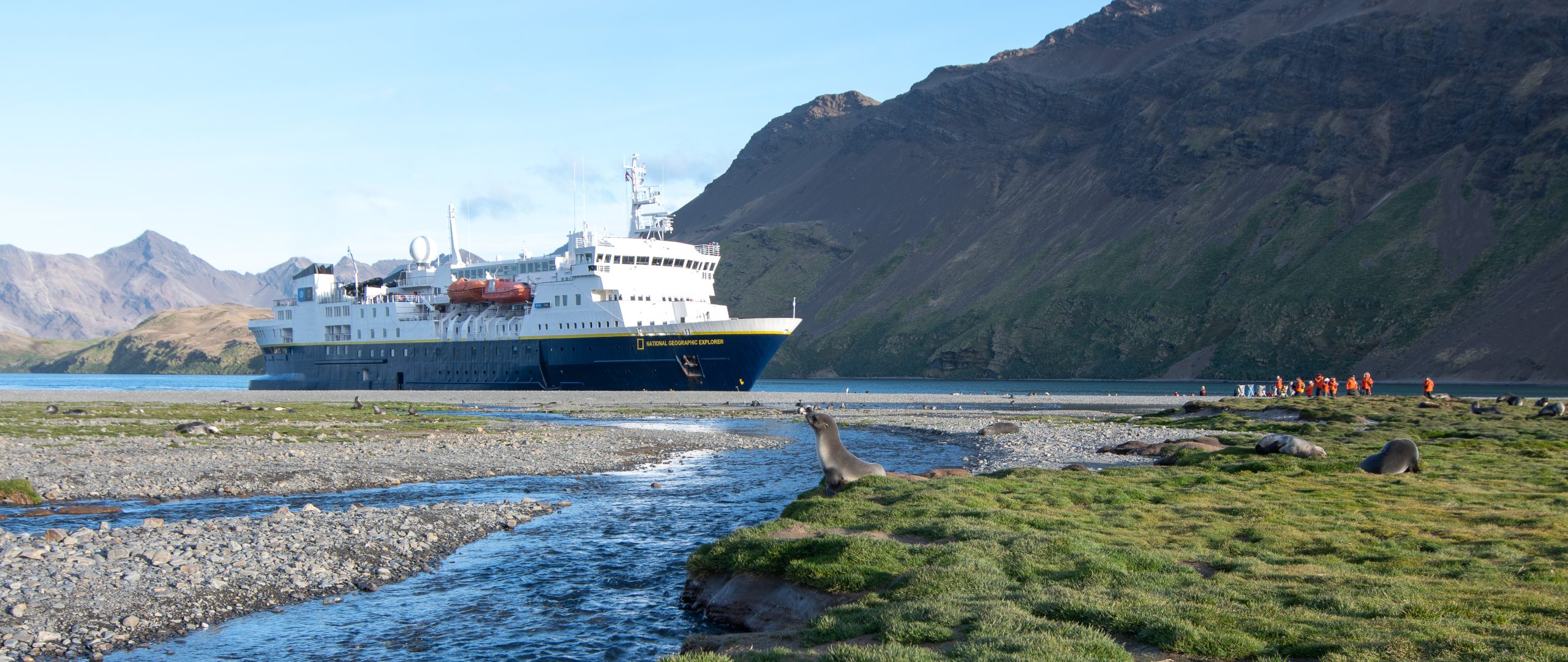 The ship National Geographic Explorer anchored close to shore in South Georgia.