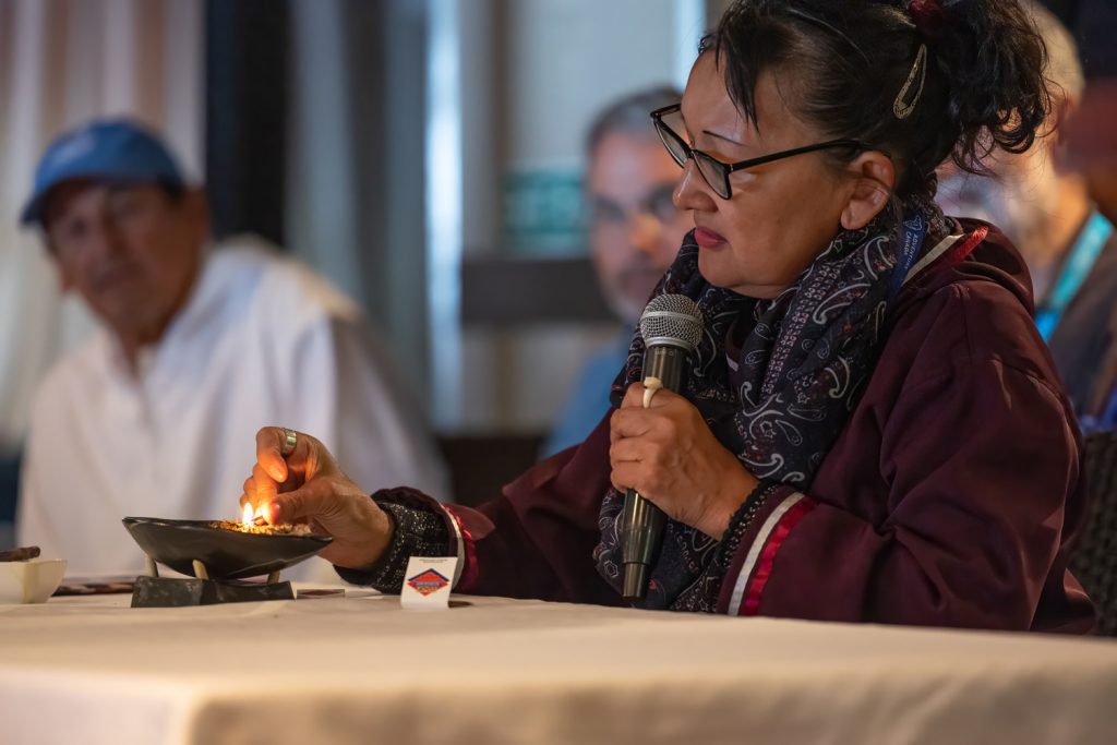 An Inuit guide giving presentation onboard ship.