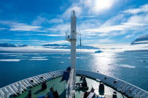 Bow of a ship sailing in icy waters. 