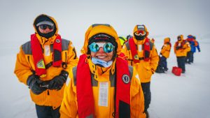 Guests walking on fast ice in Antarctica. 