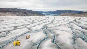 Guests standing on Greenland Ice Sheet. 