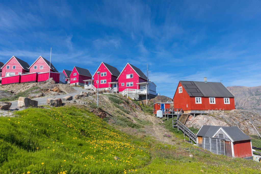 Red houses on a hillside in West Greenland.
