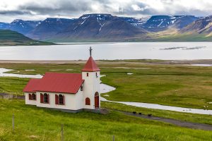 A small church in Icelandic fjord. 
